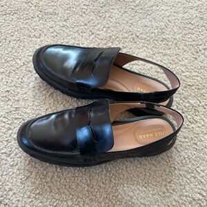 Cole Haan Grand 360 black leather loafers with lug sole and slingback design